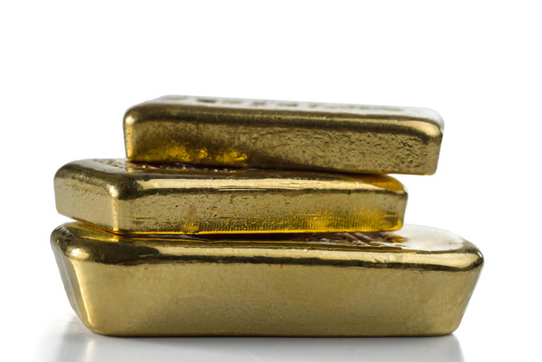 Three gold bullion bars isolated on white background. - Photo, Image