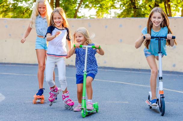 Little girls riding and competing in the skatepark - Photo, image