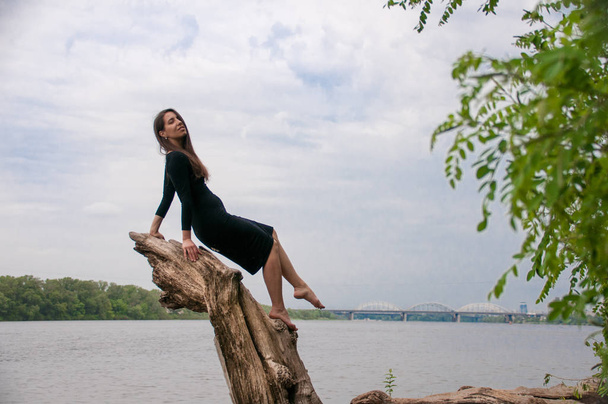 White woman stands near a beautiful lake - Photo, Image