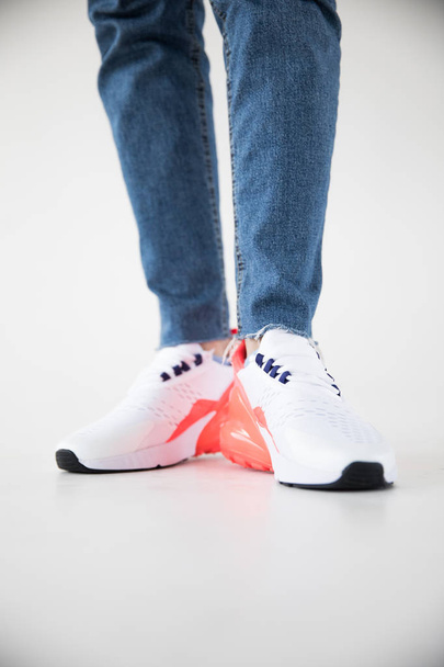 sports white pink sneakers on the model. - Foto, Imagem