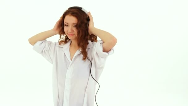 The girl in the headphones rhythmically dances. Slow motion. - Footage, Video