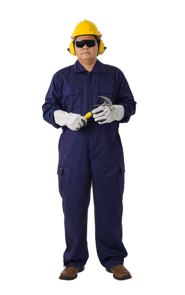 Full body portrait of a worker in Mechanic Jumpsuit is Holding a - Foto, Bild