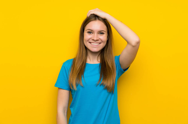 Young woman with blue shirt laughing - Foto, afbeelding
