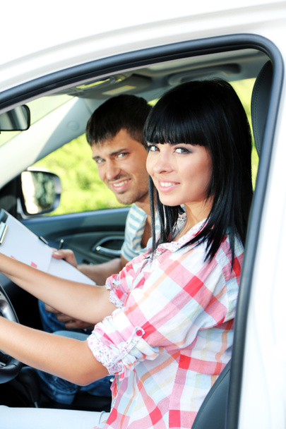 Beautiful young woman taking driving lesson - Photo, image