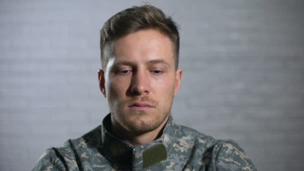 Crying male soldier looking at camera, military posttraumatic syndrome, problem - Filmagem, Vídeo