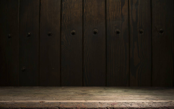 Selected focus empty brown wooden table and wall texture or old black brick wall blur background image. for your photomontage or product display - Foto, Bild