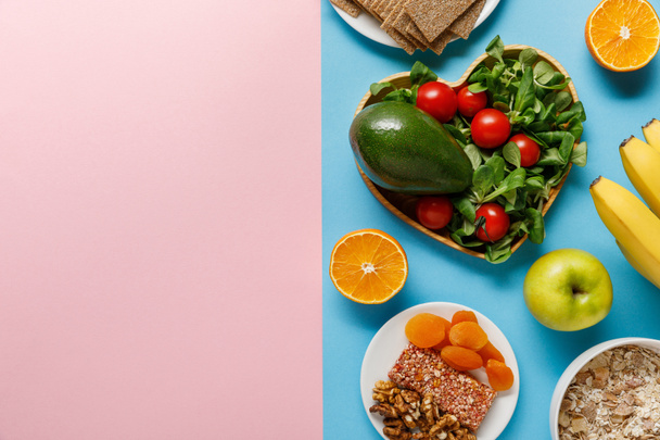 top view of diet food on blue and pink background with copy space - Zdjęcie, obraz