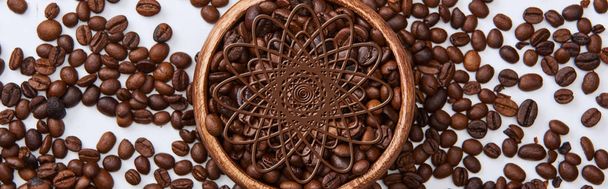 panoramic shot of tasty coffee roasted beans in wooden bowl on white background - Zdjęcie, obraz
