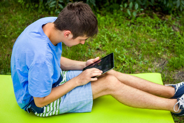 Young Man with a Tablet - Фото, зображення