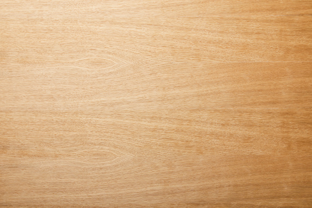 bovenaanzicht van leeg beige houten oppervlak met Kopieer ruimte - Foto, afbeelding