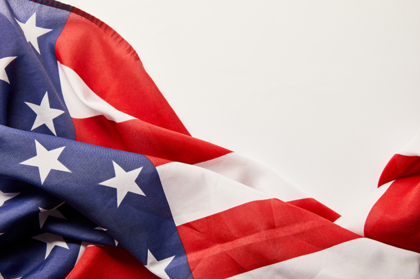 top view of crumpled stars and stripes on white background with copy space - Fotó, kép