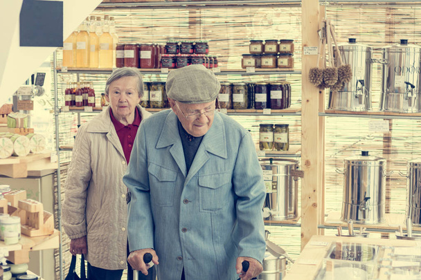 Elderly couple in a zero waste store bulk shopping. - Photo, Image