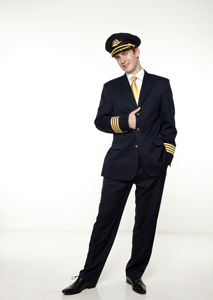 Young man in the form of a passenger plane pilot - Φωτογραφία, εικόνα
