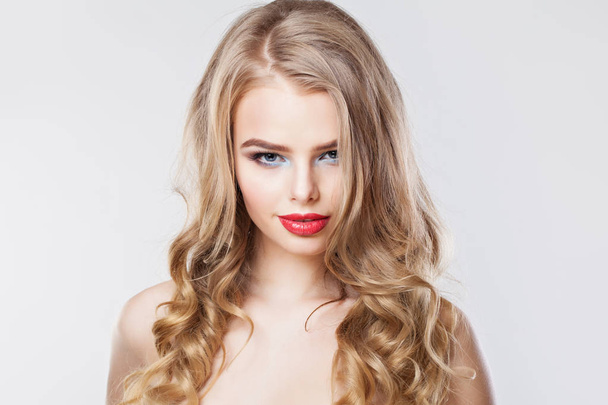 Beautiful young woman with curly hairstyle. Blonde woman  - 写真・画像