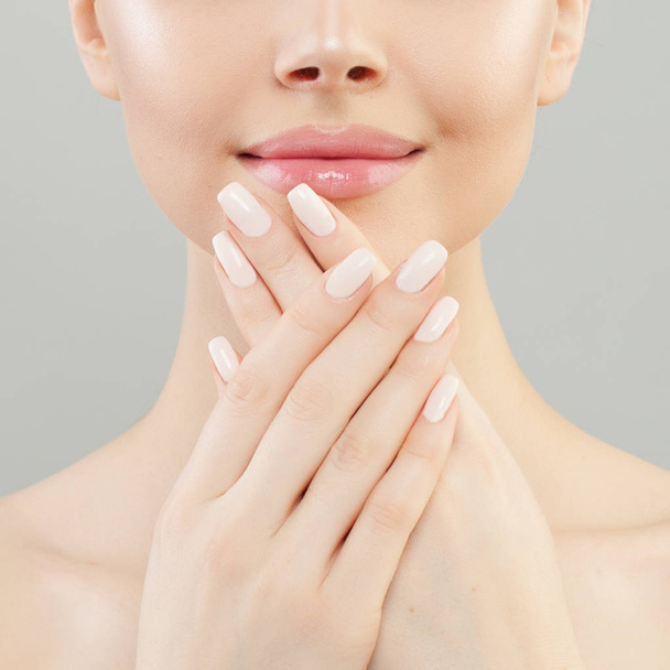 Manicure concept. Woman hands with white nails closeup - Fotó, kép