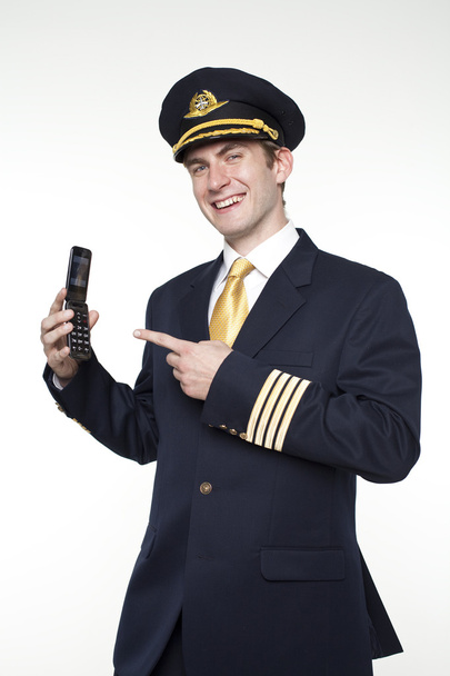 Young man in the form of a passenger plane pilot - Фото, изображение