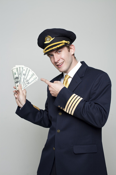 Young man in the form of a passenger plane pilot - Photo, image