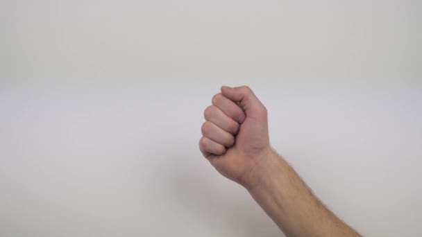 hand on white background shows different gestures - Video, Çekim