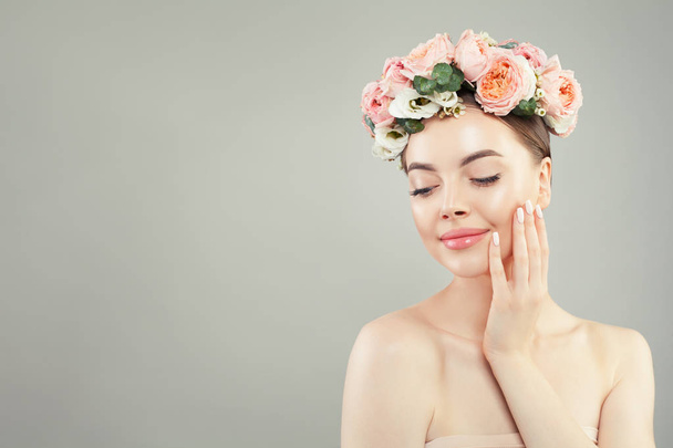 Young cute woman with healthy skin and flowers. Skin care  - Photo, Image