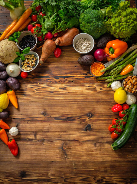 Assortment of fresh vegetables on wooden background - Фото, изображение