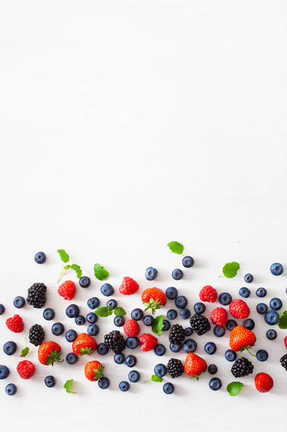assorted berries over white background. blueberry, strawberry, r - Fotó, kép