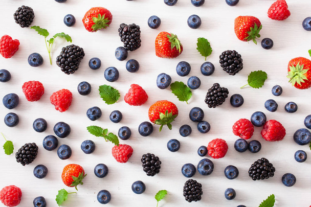 assorted berries over white background. blueberry, strawberry, r - Zdjęcie, obraz