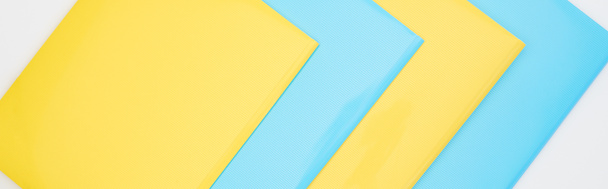 flat lay of blue and yellow folders isolated on white  - Photo, Image