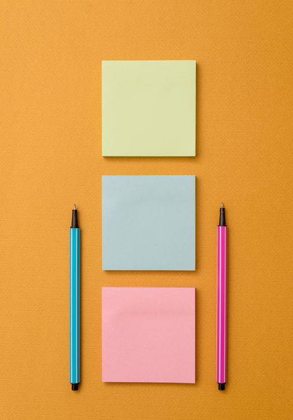Front view blank sticky note two ballpoints pens trendy pastel cool background. Empty text future important events. What to do reminder office home school - Photo, Image