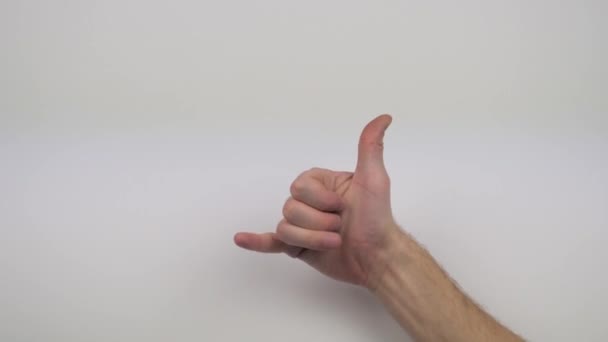 hand on white background shows different gestures - Video, Çekim