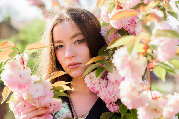 blossom smell, allergy. skincare and spa. Natural cosmetics for skin. girl in cherry flower. Sakura tree blooming. natural summer beauty. woman in spring flower bloom. You are so beautiful - Foto, Imagen