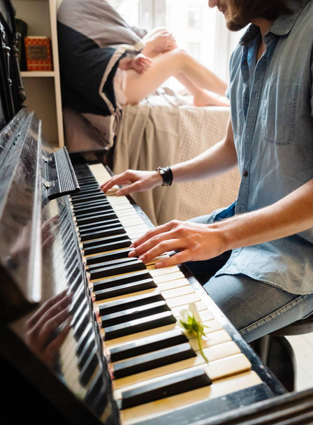 Man playing piano in the room at home  - Photo, Image