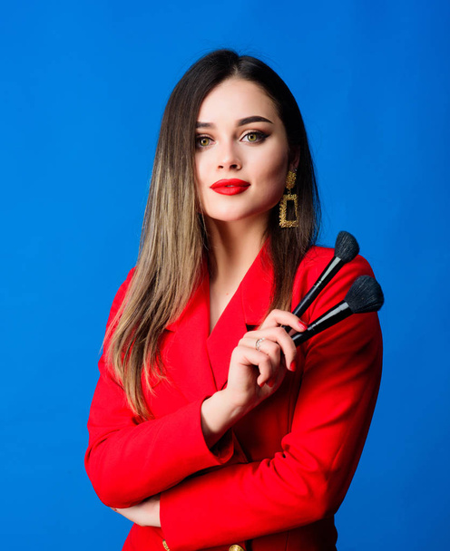 Sexy woman with professional makeup brush tool. beauty and fashion. hair beauty and hairdresser salon. jewelry earrings. Girl in red jacket. Fashion portrait of woman. Confident in her style - Фото, изображение