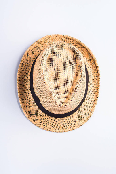 Straw hat on neutral gray background - Photo, Image