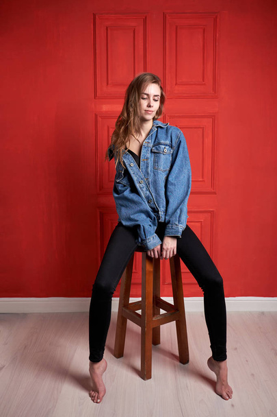 Young attractive girl or model with long hair dressed in a denim - Foto, immagini