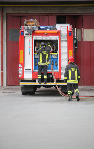Rome, RM, Italy - May 10, 2018:  fire truck and two talian firef - Fotoğraf, Görsel