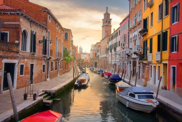 Scenic Venice view at sunset. Venice canal in downtown. Venezia  - 写真・画像