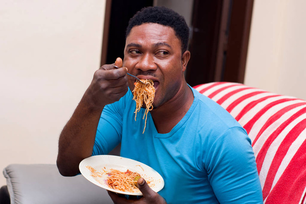 young man eating spaghetti - Photo, Image