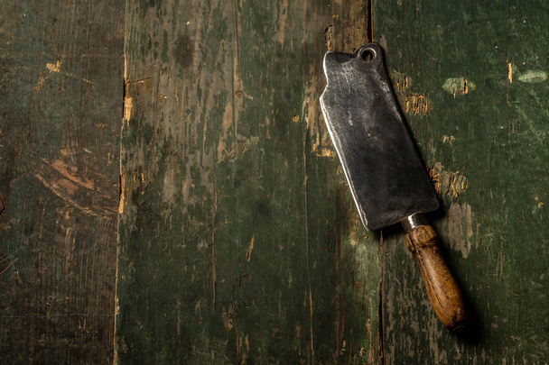 Meat Butcher Cleaver on dark wooden background with copy space. Food concept recipe menu - Photo, Image