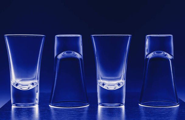 Clean shiny wine glasses in blue neon light in bar restaurant. - Fotoğraf, Görsel