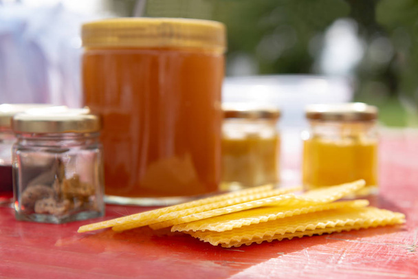 various products such as propolis, honey wax plates against blur - Photo, Image