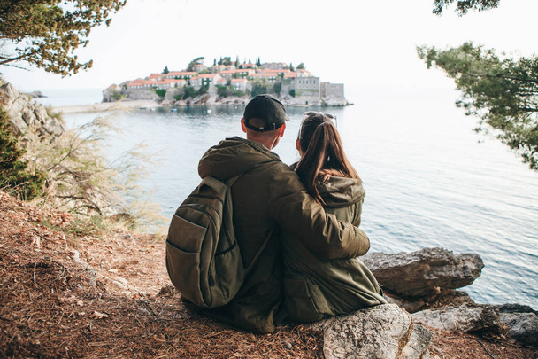 Couple looking at Sveti Stefan - Photo, Image
