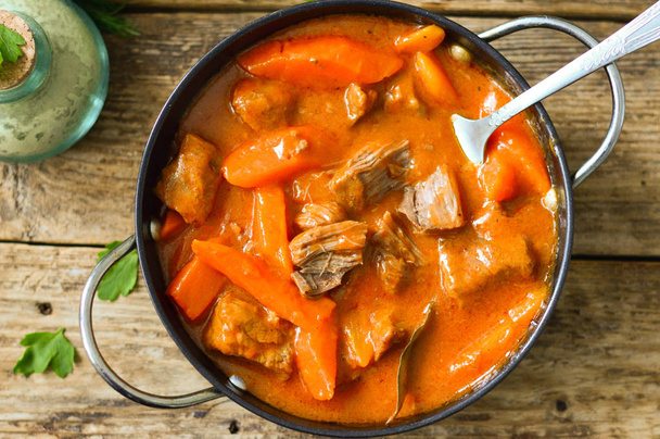 Stew with carrot in tomato sauce in a pan - Photo, Image