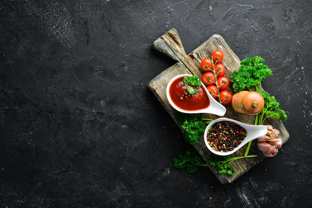 Ketchup sauce. Tomatoes, spices and herbs. Top view. Free space for your text. - Fotoğraf, Görsel