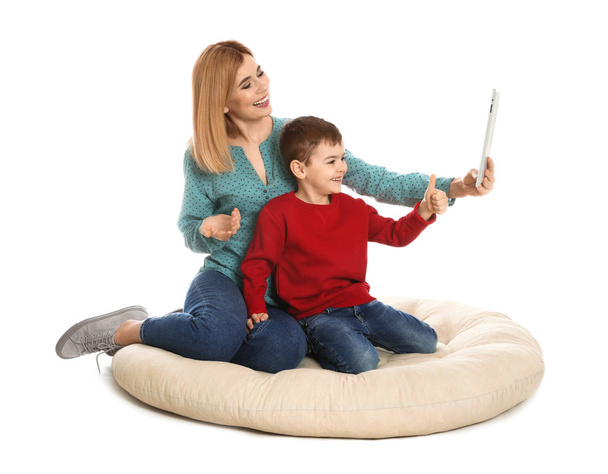 Mother and her son using video chat on tablet, white background - Fotoğraf, Görsel