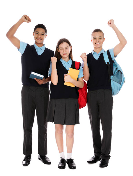 Full length portrait of teenagers in school uniform on white background - Photo, Image