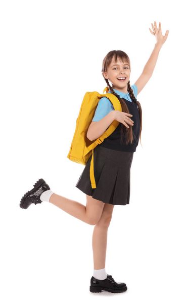 Full length portrait of cute girl in school uniform with backpack on white background - Zdjęcie, obraz