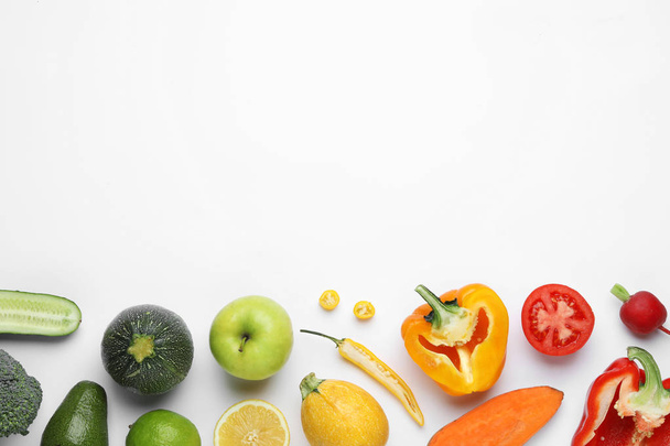 Flat lay composition with fresh ripe vegetables and fruits on white background - Photo, Image
