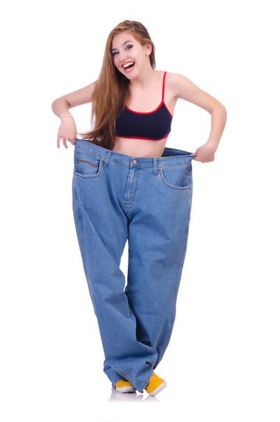 Woman in dieting concept with big jeans - Foto, afbeelding