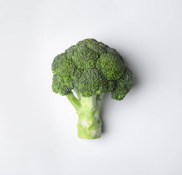 Fresh green broccoli on color background, top view. Organic food - Foto, Imagen