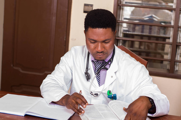A young doctor working at the office. - Photo, Image